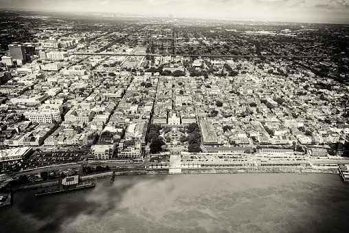 The famed French Quater of New Orleans, Louisiana in black and white and toned in sepia for a retro effect shot from an altitude of about 1000 feet featuring Jackson Square located in the center of the image.