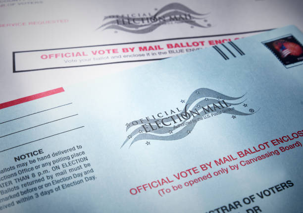 Voting ballot: Absentee voting by mail with ballot envelope stock photo
