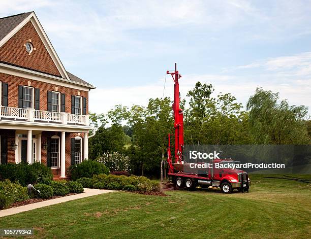Red Truck Drilling Into The Yard Stock Photo - Download Image Now - Drill, Well - Structure, Truck