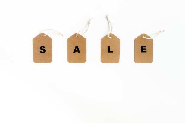 istock Black Friday sales tags concept. Craft paper tags on white background. Flat lay, top view , copy space. 1057794440