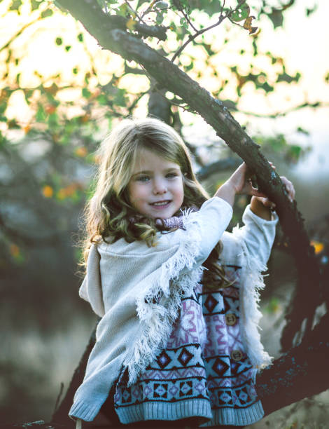 istock Little girl in autumn park 1057794620