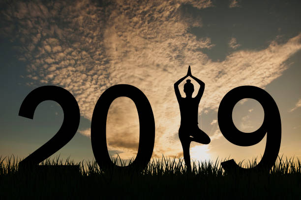 istock New year 2019 yoga concept woman pose 1057799328