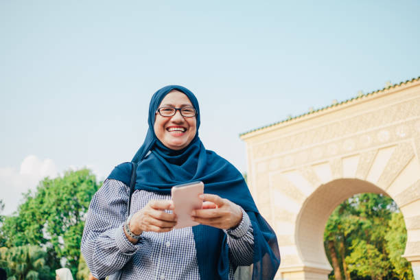 istock Asian Woman With Smartphone 1057805056