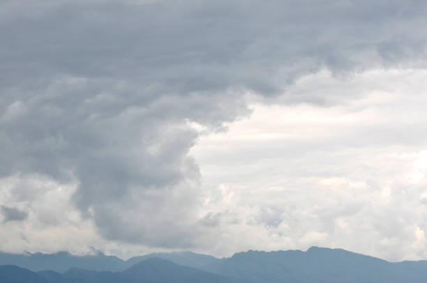 istock Gray clouds over mountain forest in autumn 1057806774