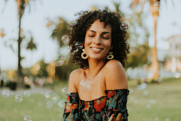 istock Beautiful woman posing in the park 1057809290
