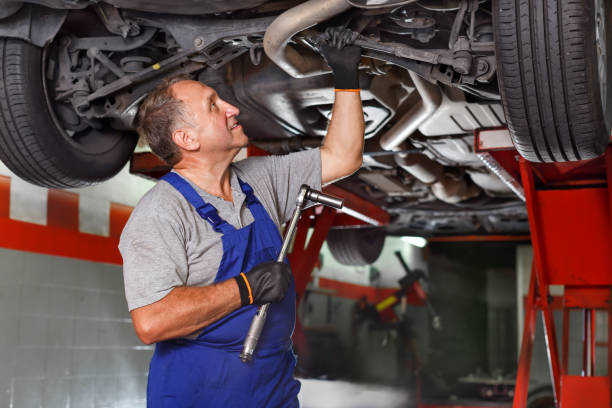 istock Technician working at service station, repairing car 1057815122