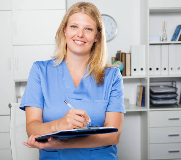 istock Smiling female nurse in formal wear 1057815672