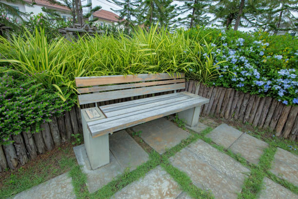istock Garden bench surrounded by flower 1057822390