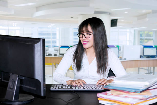 istock Business woman typing on a computer keyboard 1057822538