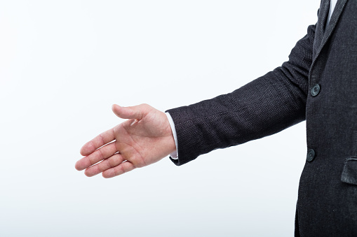 man extending hand for a handshake. business meeting or job interview.