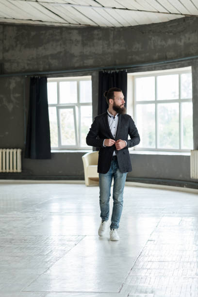 istock business man walk button suit jacket confidence 1057824428