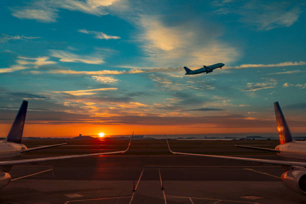 istock airplane taking off at sunrise with symmetrical lines 1057830034