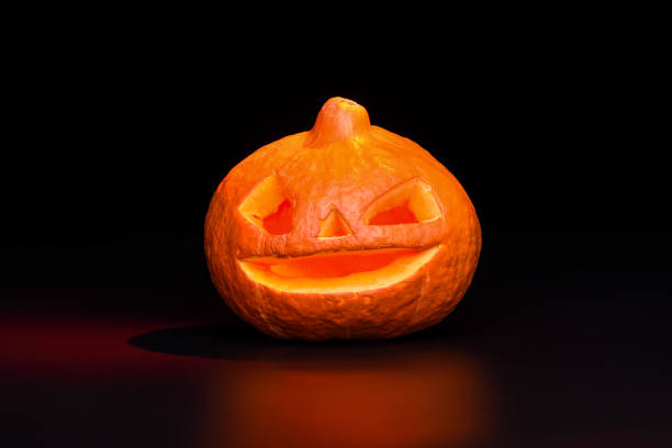istock Halloween pumpkin lantern over black background with red backlight 1057830438