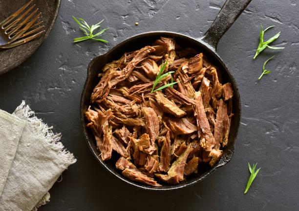 Slow cooked pulled beef for sandwiches stock photo