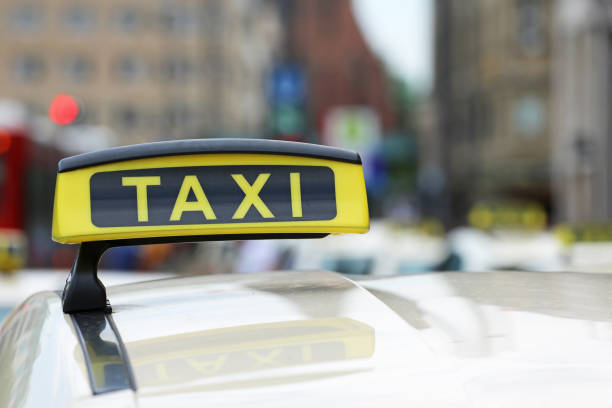 istock Taxi_sign 1057832162