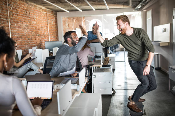 istock Cheerful businessmen having fun at corporate office. 1057835932