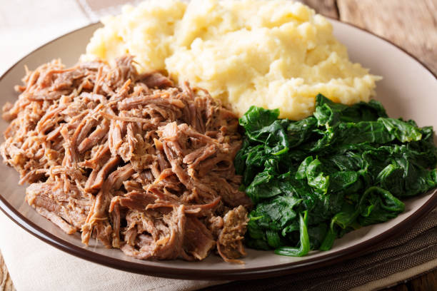 istock Botswana food - Seswaa stewed beef with Sadza from corn flour and spinach, close-up. horizontal 1057836070