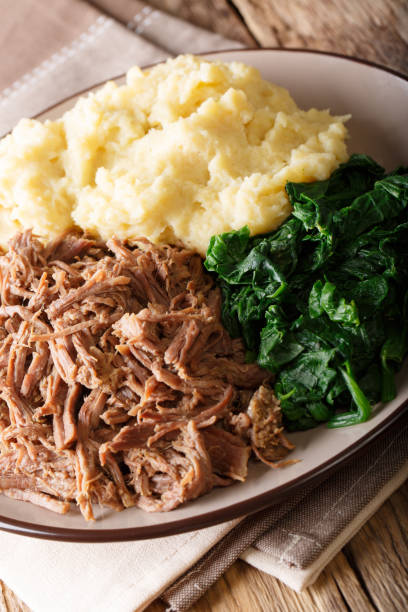 istock Botswana Beef – Seswaa with Sadza and boiled spinach close-up on a plate. Vertical 1057836354