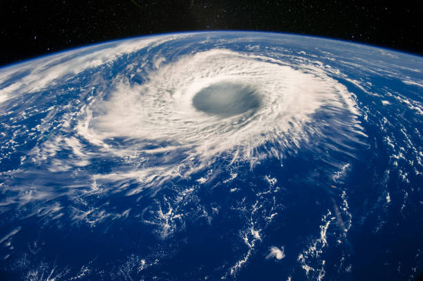 istock Hurricane eye on Earth viewed from space. Satellite view. Elements of this image furnished by NASA. Typhoon Nabi, 2005. 1057838008