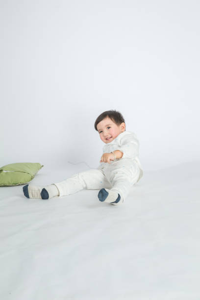 istock A little boy in pajamas plays with his pillow 1057838414