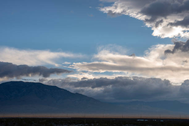 istock Mojave desert valley, mountain range, cloudy skies 1057838500
