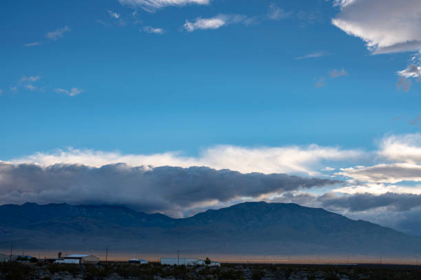 istock Mojave desert valley, mountain range, cloudy skies 1057838506