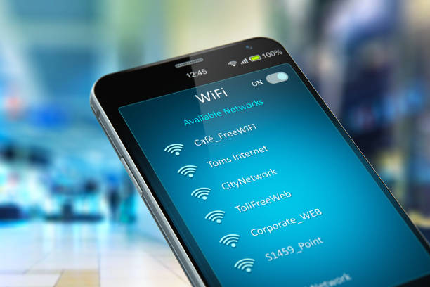 List of WiFi networks on smartphone in the shopping mall Creative abstract wireless networking on mobile devices business communication technology concept: color 3D render illustration of modern black glossy touchscreen smartphone with list of WiFi network connections message on screen in the shopping mall or airport terminal with selective focus bokeh blur effect wireless technology stock pictures, royalty-free photos & images