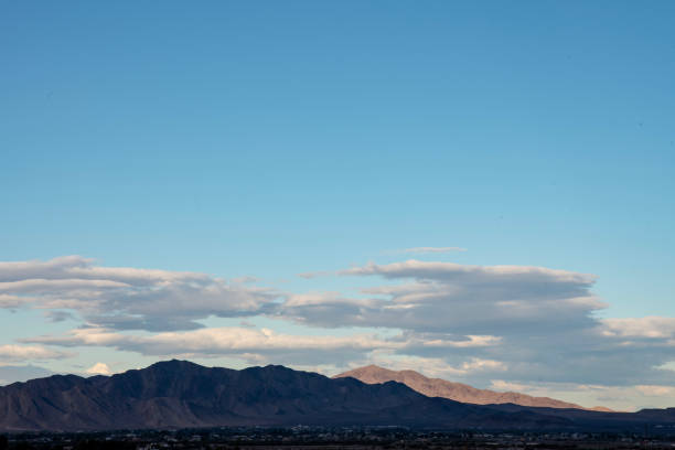 istock Mojave desert valley, mountain range, cloudy skies 1057838824
