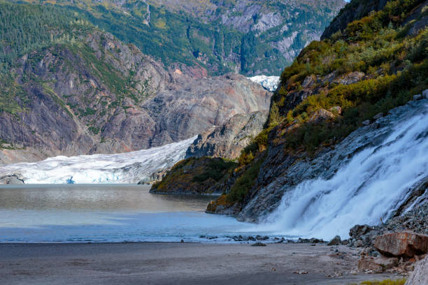 istock Waterfall near Mendenhall glacier,  Juneau Alaska 1057838976