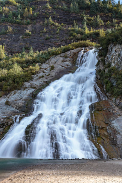 istock Waterfall near Mendenhall glacier,  Juneau Alaska 1057838988