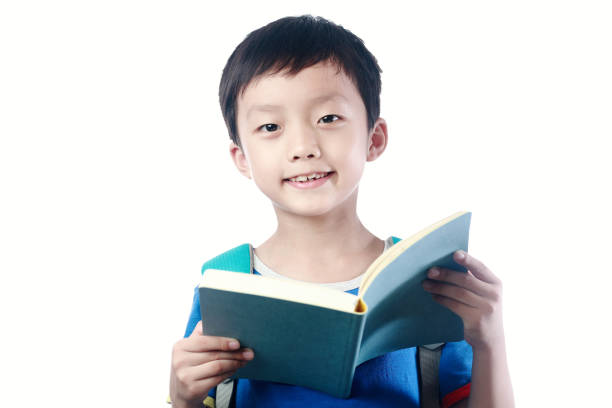 istock Little asian boy with schoolbag against white background 1057843216