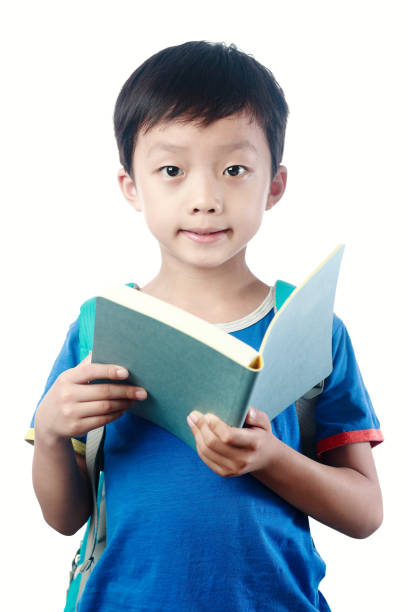 little asian boy with schoolbag against white background - little boys preschooler back to school backpack imagens e fotografias de stock