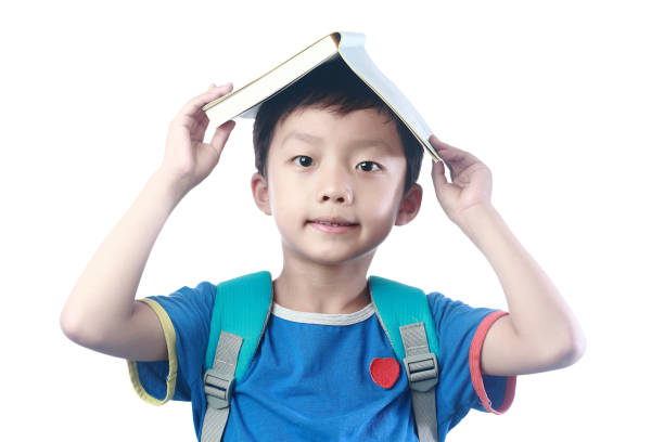 istock Little asian boy with schoolbag against white background 1057843306