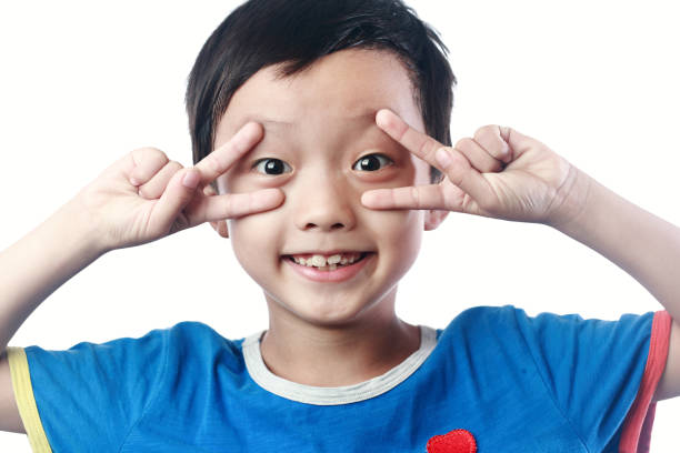 istock Kid 8 years old silly face thumbs up 1057843952