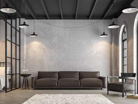 Loft living room and bedroom 3d render,There are white brick wall,polished concrete floor.Furnished with dark brown leather sofa ,There are arch shape windows sunlight shining into the room.