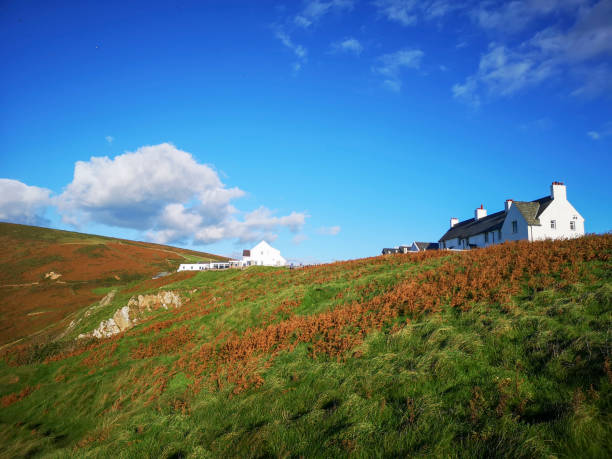 Rhossili, UK: October 06, 2018: Rhossili Bay lies at the western end of the beautiful Gower peninsula. There is a gift shop and parking available near the public path to the beach or cliff viewing area.
