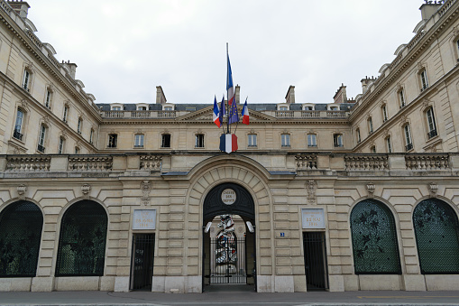 Paris : Hotel de Matignon entrance,  with french flag. It's a State building of french administration, where the first minister (head of government) work, with all his team, senior official and official or public servant. Situated rue de Varenne in Paris, 7 th district – arrondissement – in France.