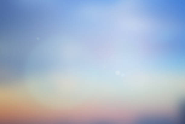 abstract blurred sunset dawn or early sunrise time sky in gradient color beautiful natural background lens ray flare flash sunlight light.