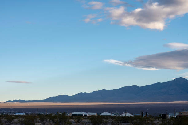 istock Mojave desert valley, mountain range, cloudy skies 1057850830