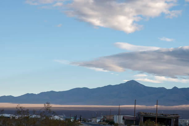 istock Mojave desert valley, mountain range, cloudy skies 1057850998