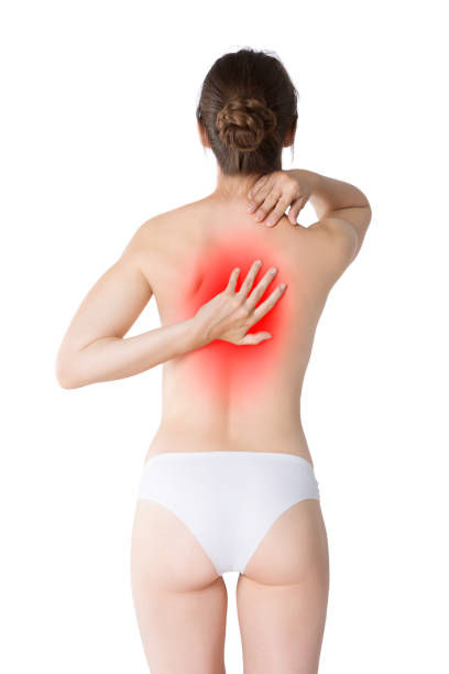 istock Back pain, woman with backache isolated on white background 1057851080