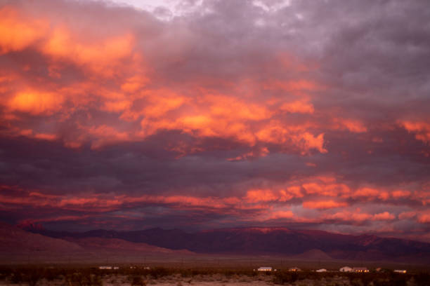 istock Mojave desert valley, mountain range, cloudy skies 1057851970
