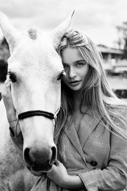 Portrait of beautiful young woman and horse