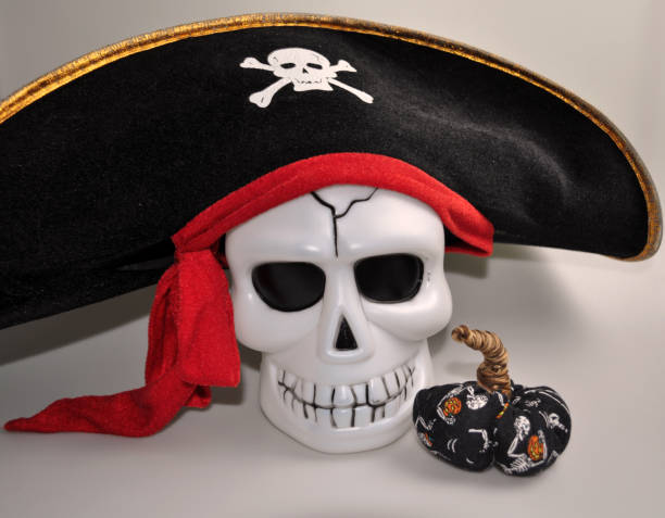 istock halloween - cute skull with decorative pumpkin 1057853616