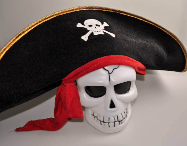 istock halloween - cute skull with decorative pumpkin 1057853630