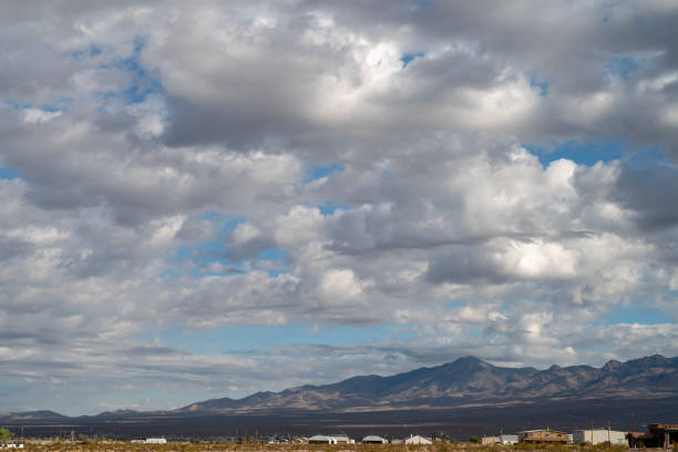 istock Mojave desert valley, mountain range, cloudy skies 1057853644