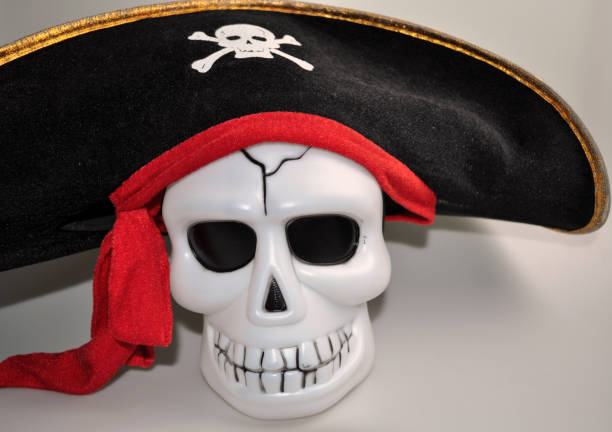 istock halloween - cute skull with decorative pumpkin 1057853652