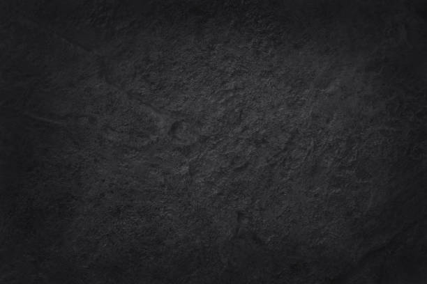 istock Dark grey black slate texture in natural pattern with high resolution for background and design art work. Black stone wall. 1057855048