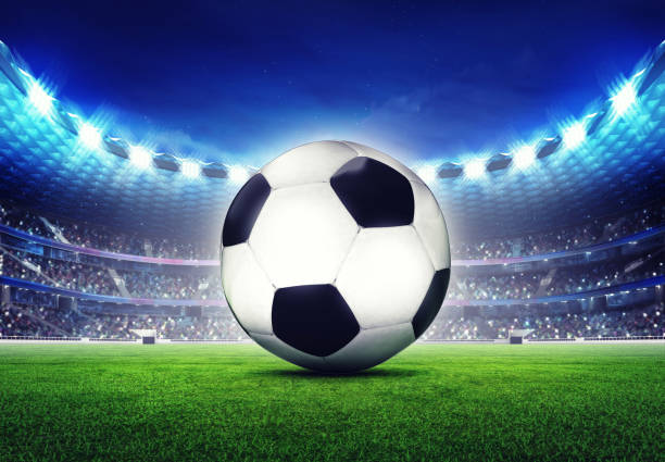 istock football stadium with ball front 1057856322