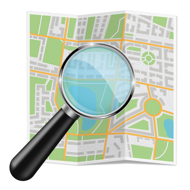 istock Folded city map. Abstract cartography with zooming glass 1057857480